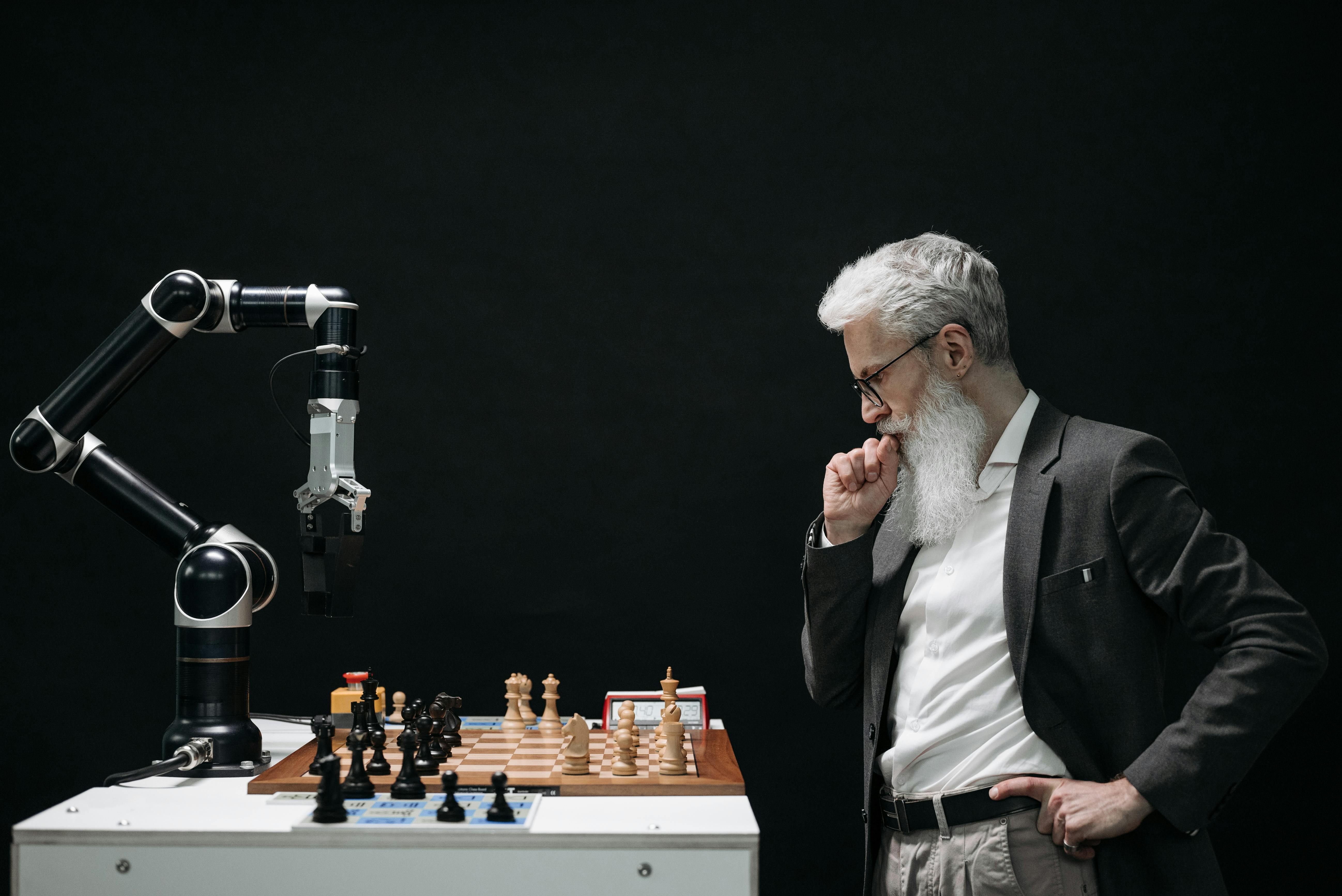 Man contemplating a chess game against a robotic arm — where human strategy meets machine intelligence